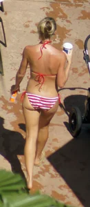 Blonde babe at the pool with sexy body in USA bikini