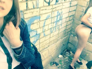 Girl Pulling Up Skirt and Flashing Her Booty