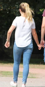 Blonde chick walking with her boyfriend in tight jeans