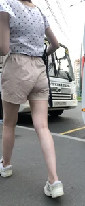 Cute Girl in a Blouse and Shorts With Thin Legs Bus Stop Candid Photo Gallery