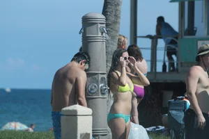 More sexy girls in bikinis and thongs at Deerfield Beach in Florida