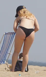 Two thick white girls in bikinis on the beach with big asses