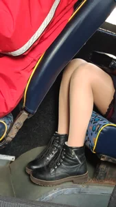 Legs in Pantyhose in the Bus Closeup