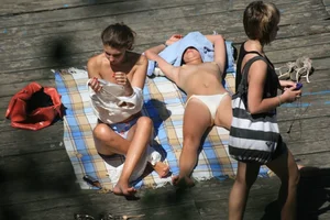 Two teens stripping and going topless to tan