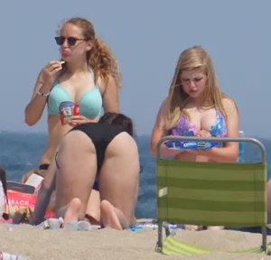 3 girls on the beach in bikinis with big boobs, one brunette and two blondes