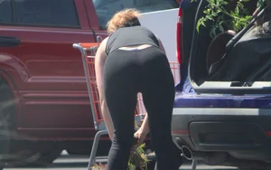 Redhead milf with a nice ass and vtl in leggings while loading her car