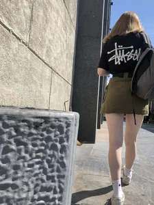 Cute Candid Teen Girl in a Skirt With a Backpack Passing By on the Street - Very Pale Legs With Smooth Skin