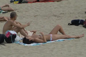 Topless girls on a beach in Barcelona
