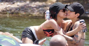 Sexy party girls in bikinis on a lake