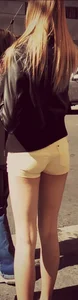 Skinny blonde girl in little yellow shorts with a tight ass