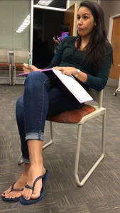 Sexy student in blue jeans and flip-flops