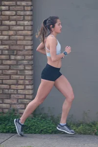 Beautiful girl out for a run in spandex shorts
