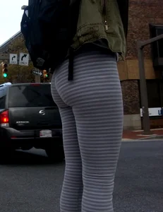College girl in striped leggings walking with nice ass