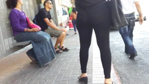 Sexy ass in leggings waiting for the bus