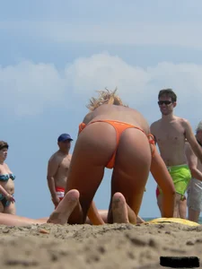 Two topless friends on the beach with nice boobs