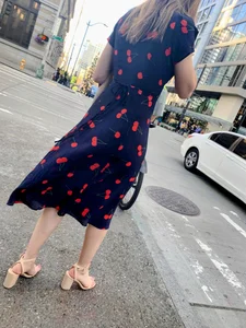 Business women with a visible thong in a see through Cherry Dress