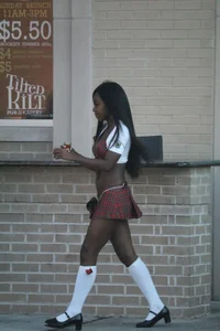 Sexy ebony Tilted Kilt employee in her uniform