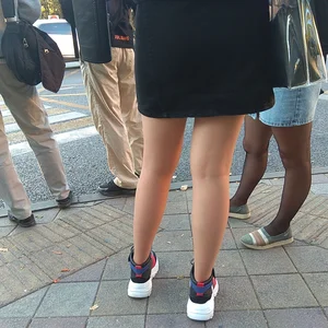 Girl in a Skirt Street Legs Closeup