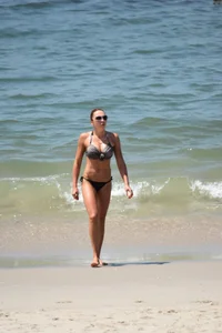 Redhead with nice tits in a bikini on the beach