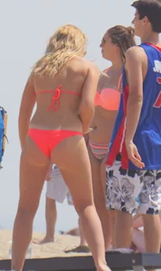Sexy thick blonde girl with tiny bikini and big booty on the beach