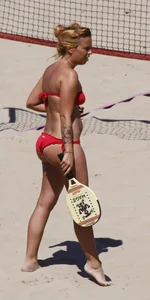 Redhead with nice ass and back dimples in red bikini on the beach
