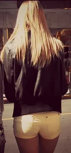 Skinny blonde girl in little yellow shorts with a tight ass