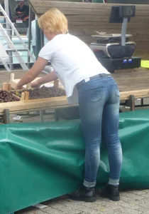 Blonde mature milf with short hair wearing tight jeans bend over at the street market creepshot