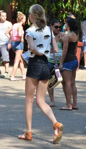 Skinny blonde chick in little denim shorts