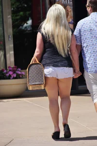 Thick blonde with big boobs in short white shorts