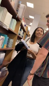 Pretty babe in tight jeans showing nipples in book store w bf (Not OC)(Face shot)