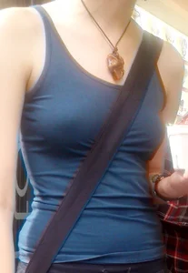 Braless babe in tank top with puffy pokies