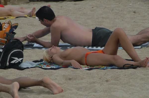 Topless girls on a beach in Barcelona