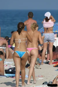 Beach voyeur girls in bikinis, thongs and topless