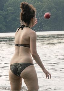 Cute girl in a swimsuit at the lake