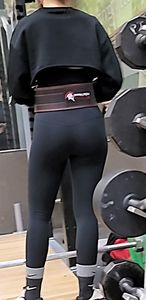 Petite Asian in Lulus bent over and squatting