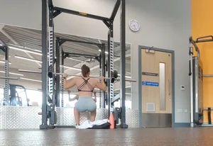 Gym brunette in tight grey shorts