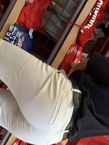 Bunch of girls in various outfits at a Cardinals baseball game