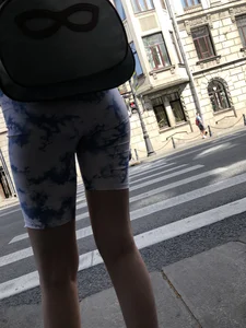 Cute candid girl in tight shorts on a crosswalk