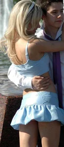 Blonde Teen JB Posing for a Photo in Front of a Fountain