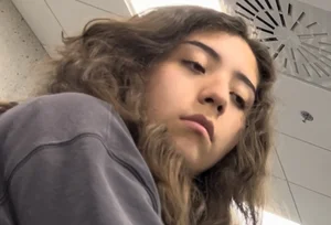 College Vpl Latina In Dark Grey Leggings Going Up The Stairs