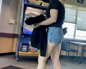 Short shorts and a Louis Vuitton backpack