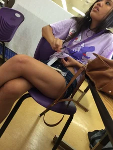 Girl Sitting in a Cafe with her Legs Crossed Dressed in Mini-Shorts Candid