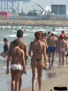 Bunch of sexy babes at the beach in thong bikinis