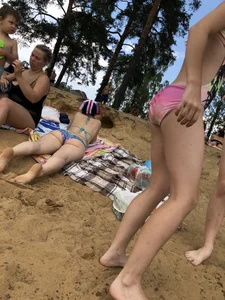 Girls in One-Piece Body Swimsuits Running Towards Water and Swimming - Beach Photo Gallery