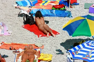 Ula FKK Sexy brunette on a nude beach topless, bottomless and with blue thong