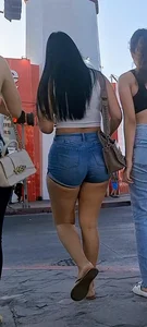 super sexy denim short shorts on this brunette with tremendous legs and big butt