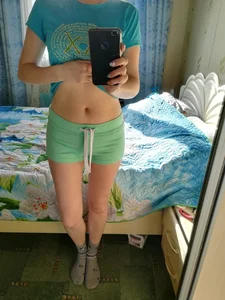 Skinny Girl in Socks and Shorts Pulling Up T-Shirt Showing Stomach - Bedroom Mirror Selfie