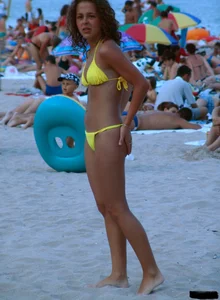 A bunch of sexy beach voyeur babes in bikinis, thongs and topless