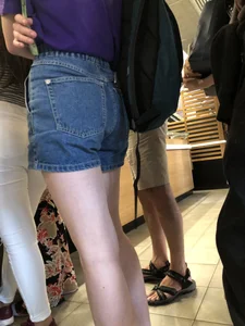 Hot Bare Legs in Blue Denim Shorts Closeup Candid Pics Gallery in the Cafe Line