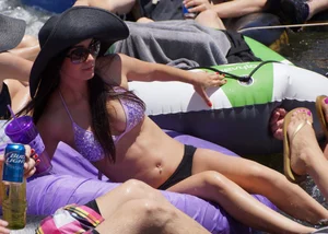 Sexy party girls in bikinis on a lake